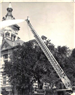Firefighter at Top of Ladder