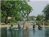 Bronze statues in a pond.